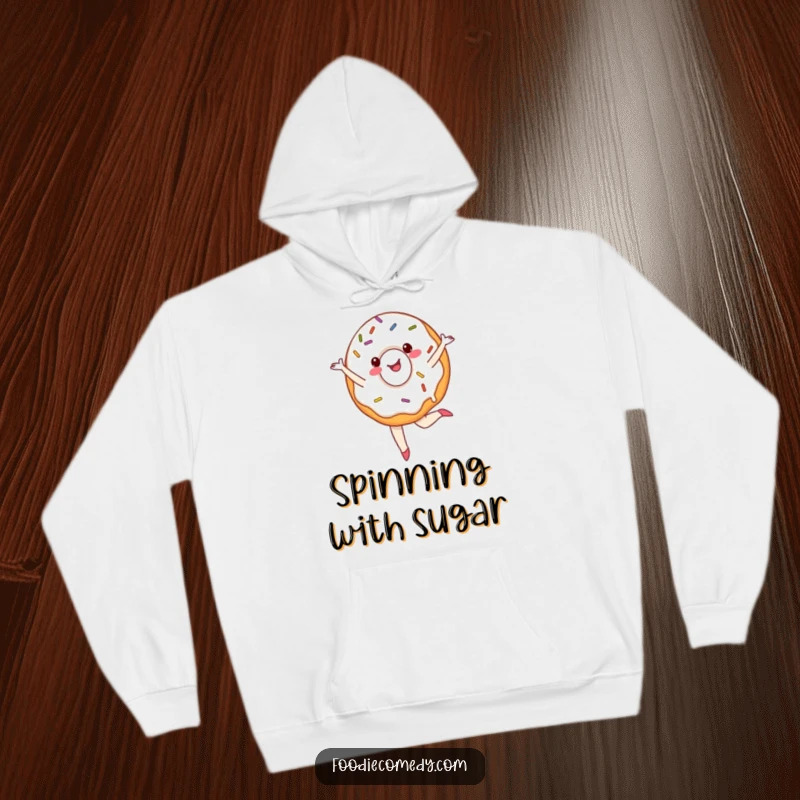 Funny donut hoodie featuring a cheerful, sprinkled donut doing a ballet pirouette, providing cozy sweetness and humor.