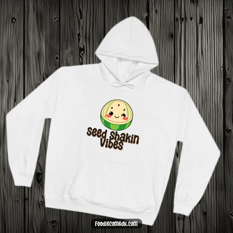 Funny watermelon hoodie featuring a whimsical watermelon slice with a face wiggling its seeds, perfect for cozy humor.